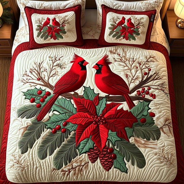 Jolly Cardinals quilted 3-piece bedding set on a made bed with two matching pillow shams
