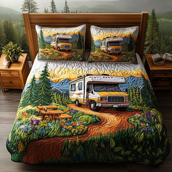 Journey Begins quilted 3-piece bedding set on a made bed with two matching pillow shams