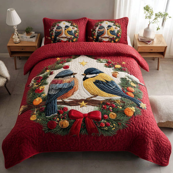 Joyful Bird Christmas quilted 3-piece bedding set on a made bed in a winter-styled bedroom