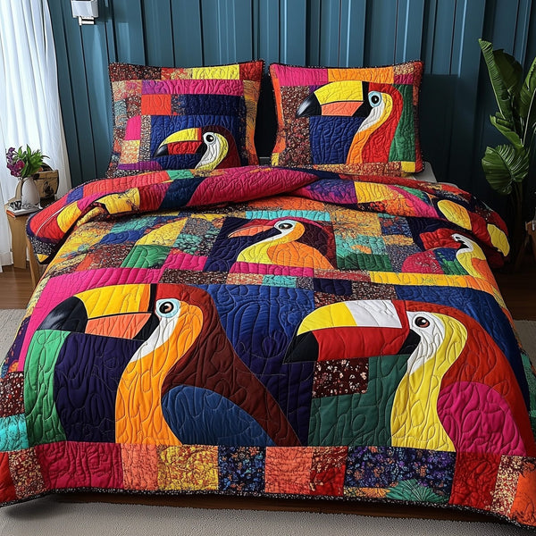 Joyful Toucan quilted 3-piece bedding set on a made bed with two matching pillow shams