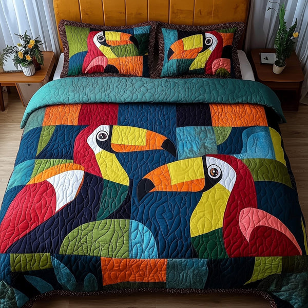 Joyful Toucans quilted 3-piece bedding set on a made bed with two matching pillow shams
