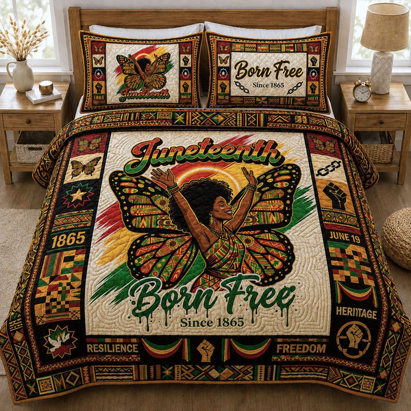 Juneteenth Born Free quilted 3-piece bedding set on a made bed in a warmly lit bedroom