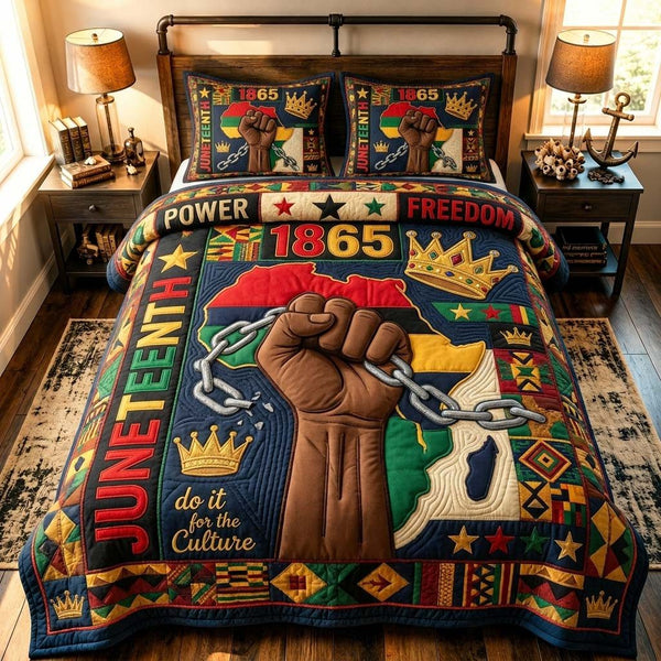 Juneteenth Culture Power quilted 3-piece bedding set on a made bed in a warmly lit bedroom