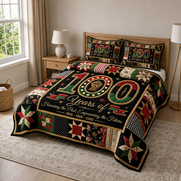 Juneteenth Pride quilted 3-piece bedding set on a made bed in a warmly lit bedroom