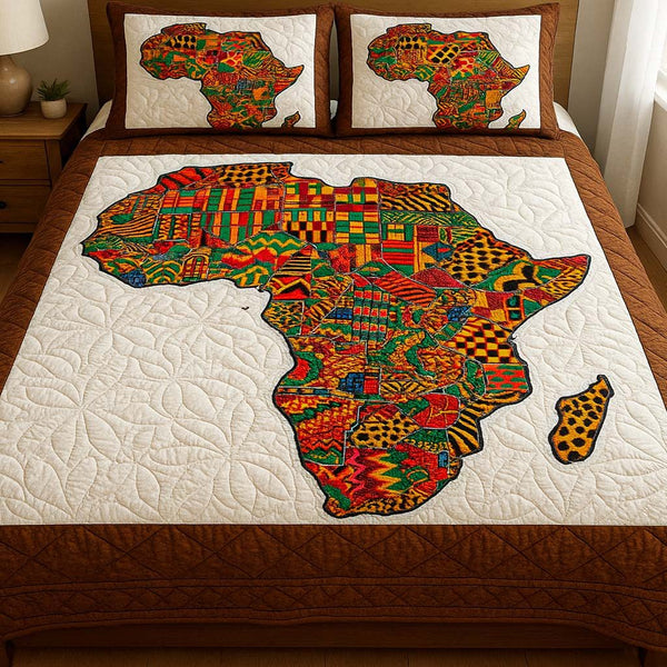 Kente Pride quilted 3-piece bedding set on a made bed with two matching pillow shams