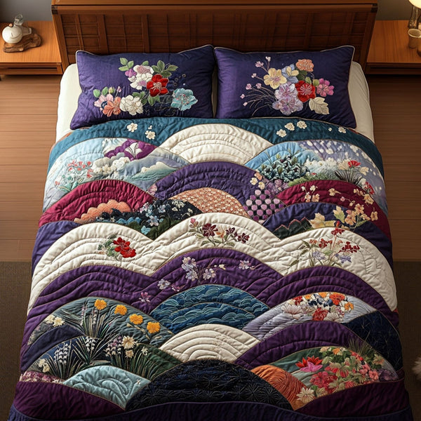 Kimonos in Bloom quilted 3-piece bedding set on a made bed with two matching pillow shams