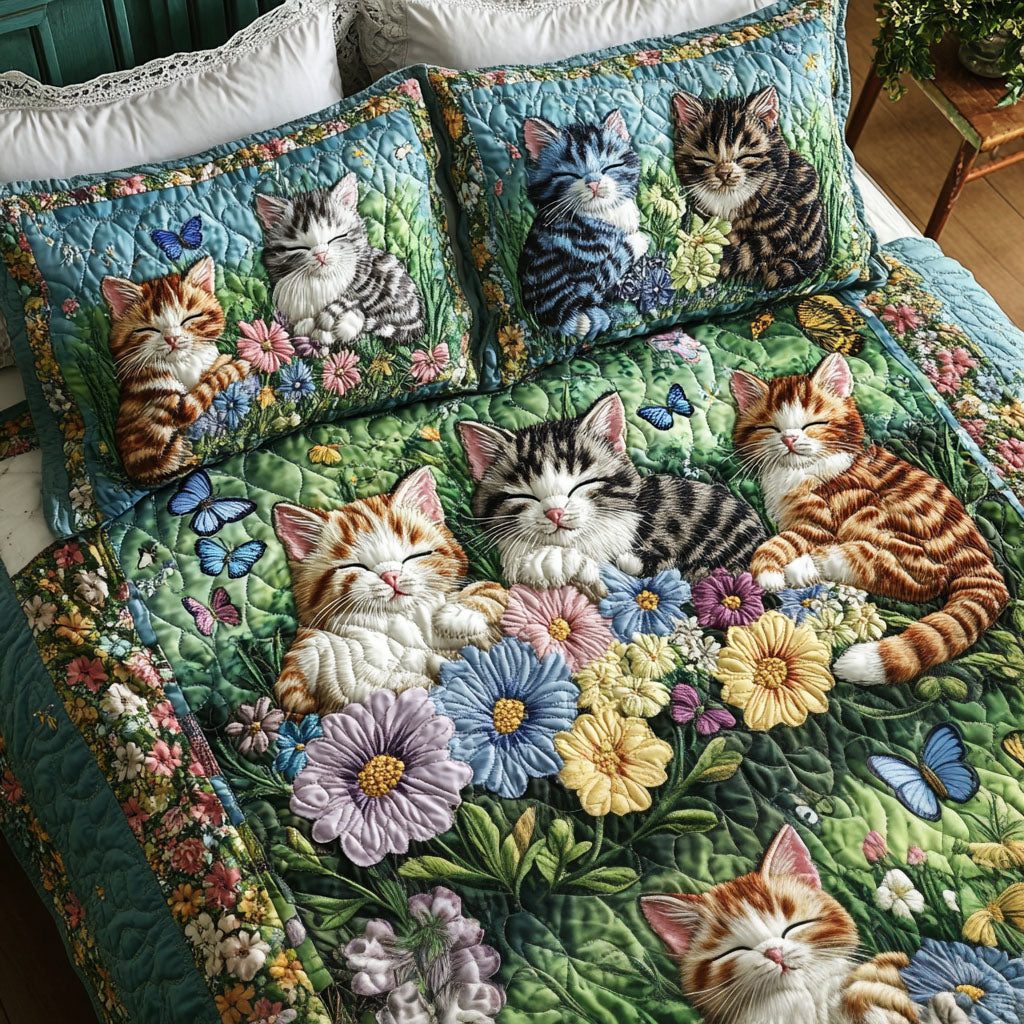 Kittens and Flowers quilted 3-piece bedding set on a made bed with two matching pillow shams