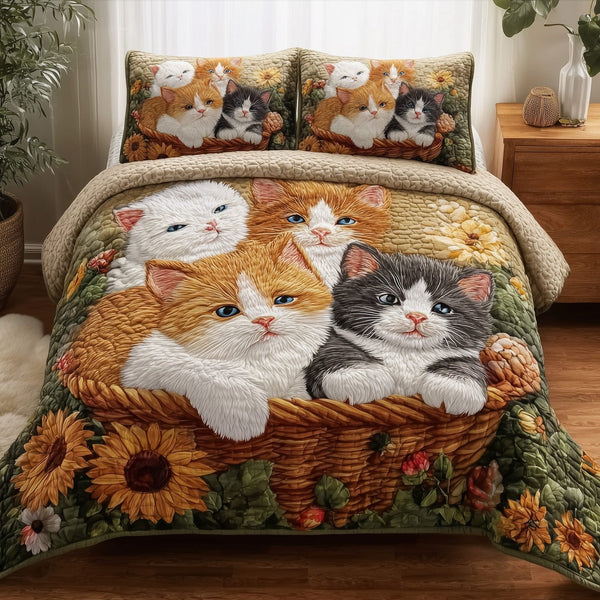 Kittens Garden quilted 3-piece bedding set on a made bed with two matching pillow shams