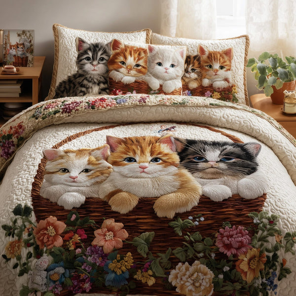 Kittens Garden quilted 3-piece bedding set on a made bed with two matching pillow shams