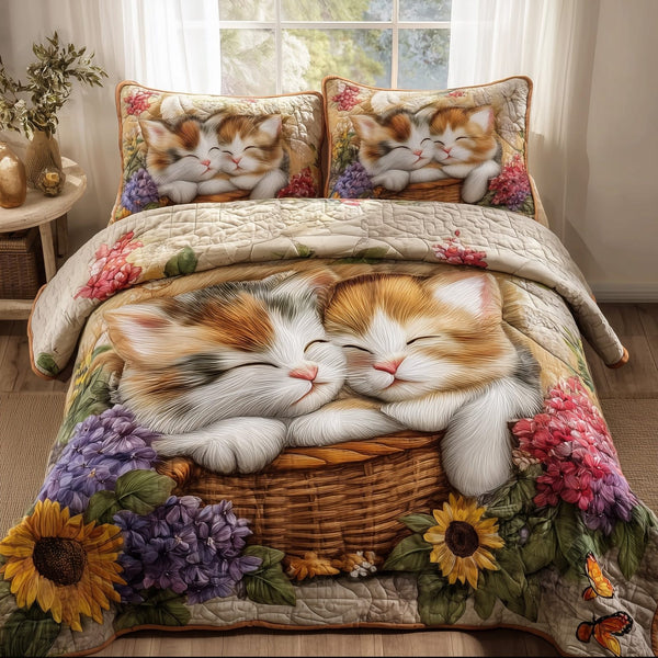 Kittens Garden quilted 3-piece bedding set on a made bed with two matching pillow shams