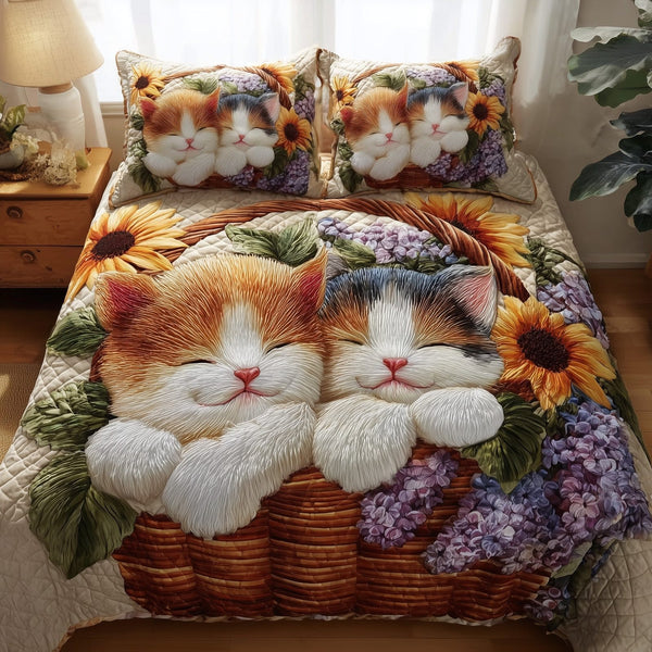 Kittens Garden quilted 3-piece bedding set on a made bed with two matching pillow shams