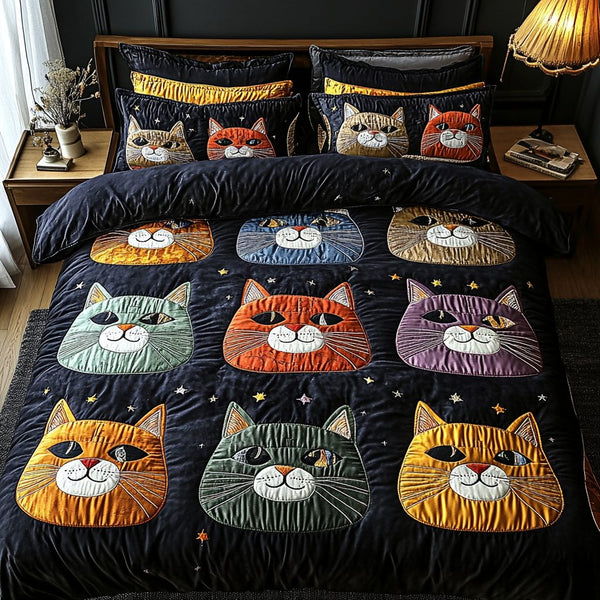 Kitty Dreams quilted 3-piece bedding set on a made bed with two matching pillow shams
