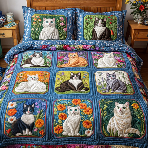 Kitty Dreams quilted 3-piece bedding set on a made bed with two matching pillow shams