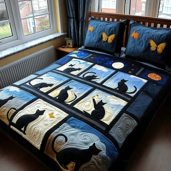 Kitty Night Dreams quilted 3-piece bedding set on a made bed with two matching pillow shams