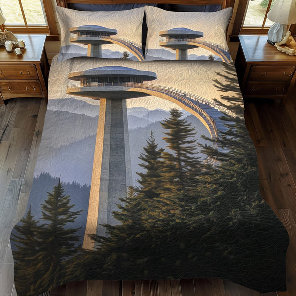 Kuwohi Horizons quilted 3-piece bedding set on a made bed with two matching pillow shams
