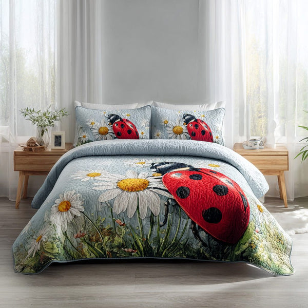 Ladybug Bloom quilted 3-piece bedding set on a made bed with two matching pillow shams