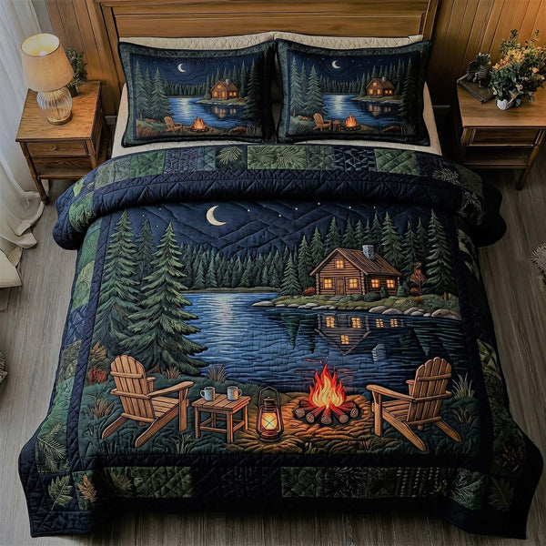 Lakeside Cabin Night quilted 3-piece bedding set on a made bed with two matching pillow shams