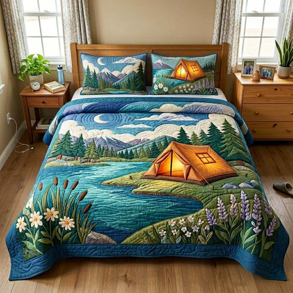 Lakeside Tent Camp quilted 3-piece bedding set on a made bed with two matching pillow shams