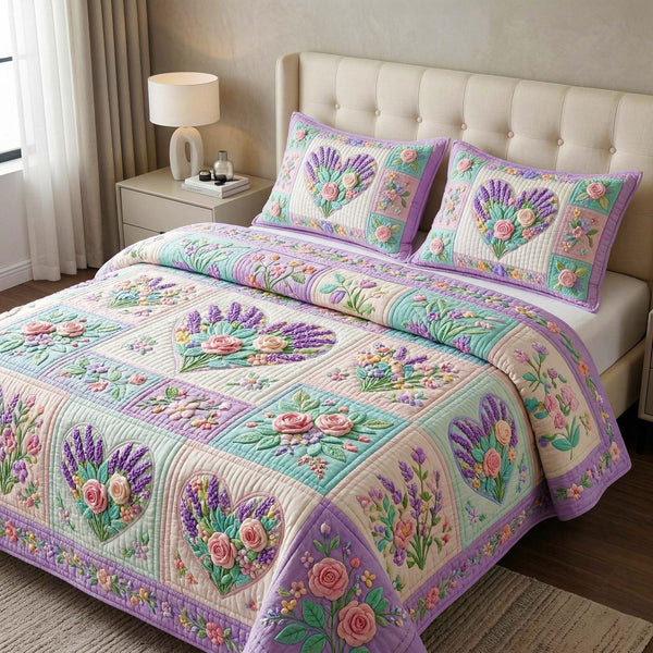 Lavender Heart quilted 3-piece bedding set on a made bed with two matching pillow shams