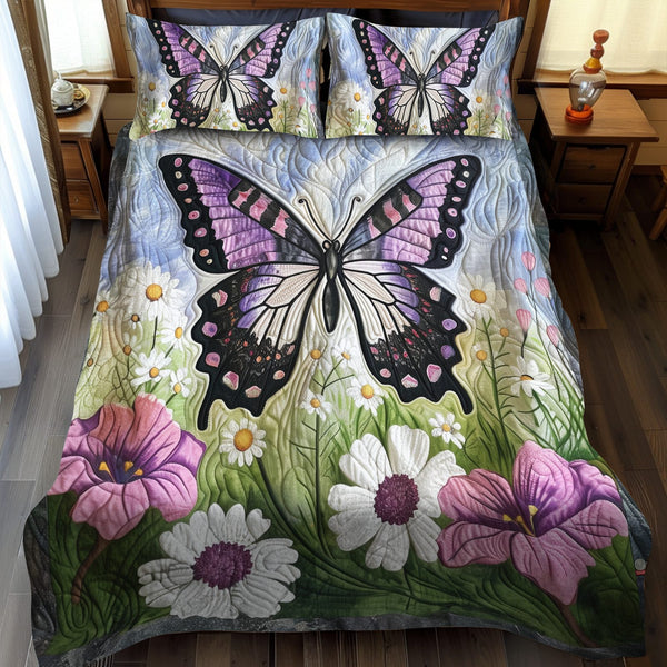 Lavender Wings Butterfly quilted 3-piece bedding set on a made bed with two matching pillow shams