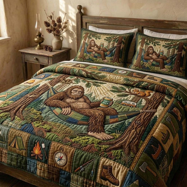 Lazy Camp Bigfoot quilted 3-piece bedding set on a made bed with two matching pillow shams