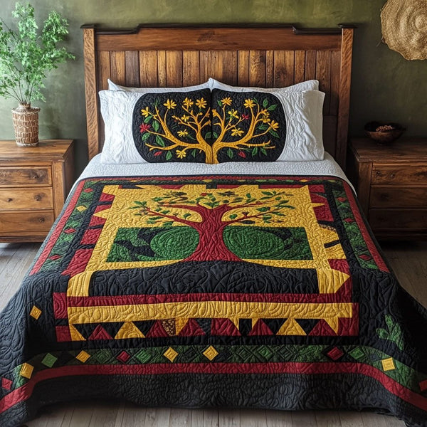Legacy of Strength quilted 3-piece bedding set on a made bed with two matching pillow shams