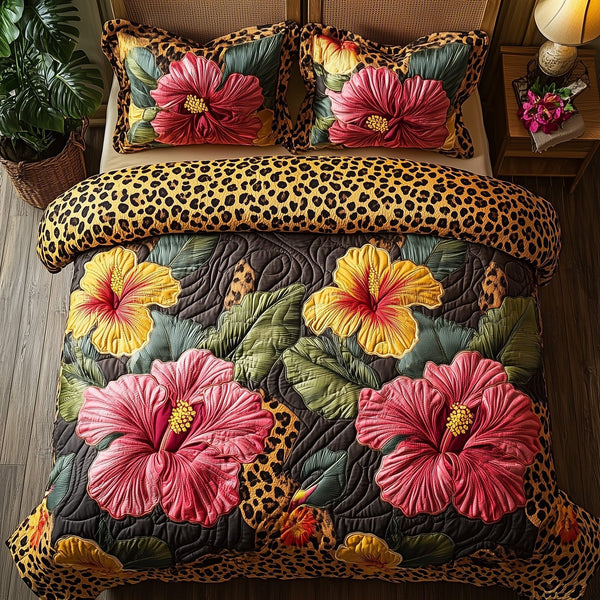 Leopard Hibiscus Heaven quilted 3-piece bedding set on a made bed in a softly lit bedroom