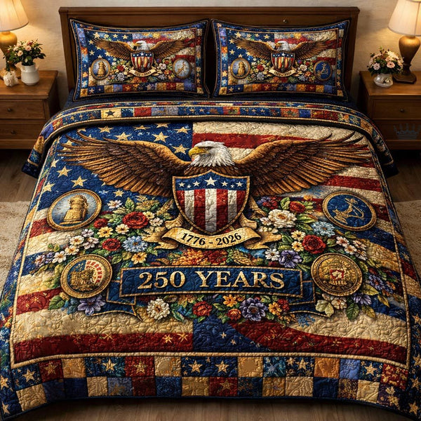 Liberty 250 quilted 3-piece bedding set on a made bed in a warmly lit bedroom