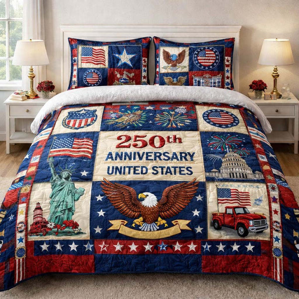 Liberty Anniversary quilted 3-piece bedding set on a made bed in a warmly lit bedroom