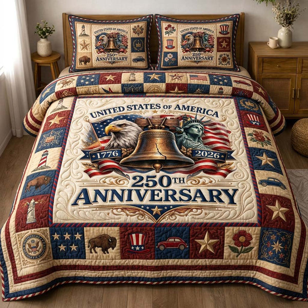 Liberty Bell quilted 3-piece bedding set on a made bed in a warmly lit bedroom