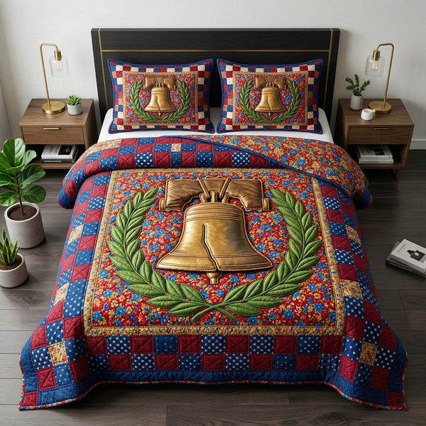 Liberty Bell quilted 3-piece bedding set on a made bed in a warmly lit bedroom
