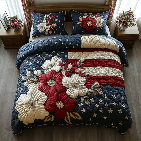 Liberty Bloom quilted 3-piece bedding set on a made bed in a warmly lit bedroom