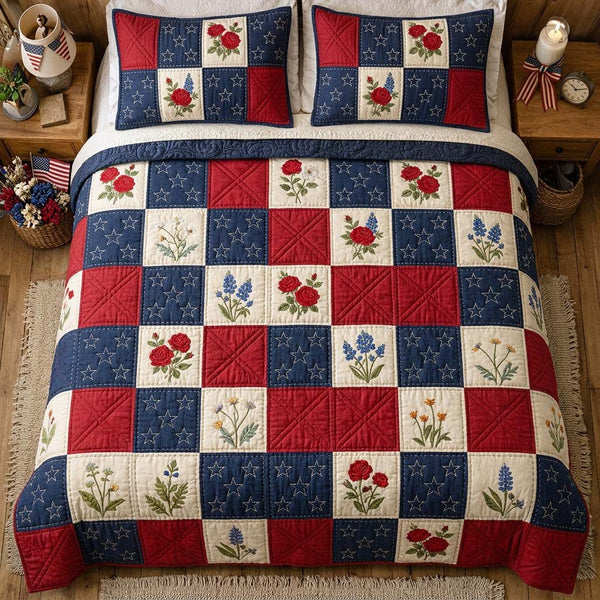 Liberty Blossom quilted 3-piece bedding set on a made bed in a warmly lit bedroom
