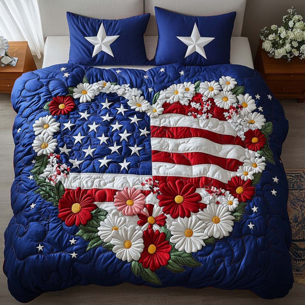 Liberty Blossom quilted 3-piece bedding set on a made bed in a warmly lit bedroom