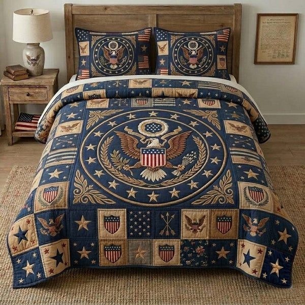 Liberty Circle Crest quilted 3-piece bedding set on a made bed in a warmly lit bedroom