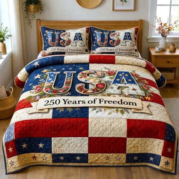 Liberty Colors quilted 3-piece bedding set on a made bed in a warmly lit bedroom