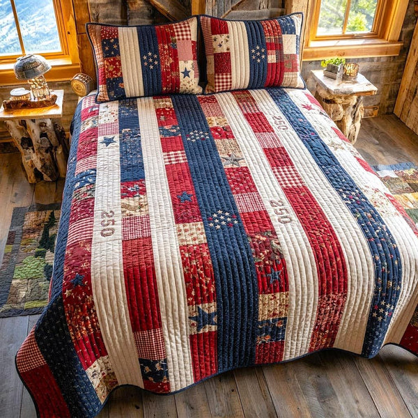 Liberty Colors quilted 3-piece bedding set on a made bed in a warmly lit bedroom