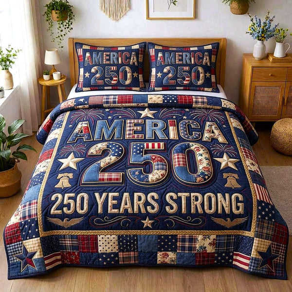 Liberty Colors quilted 3-piece bedding set on a made bed in a warmly lit bedroom