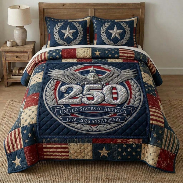 Liberty Crest quilted 3-piece bedding set on a made bed in a warmly lit bedroom