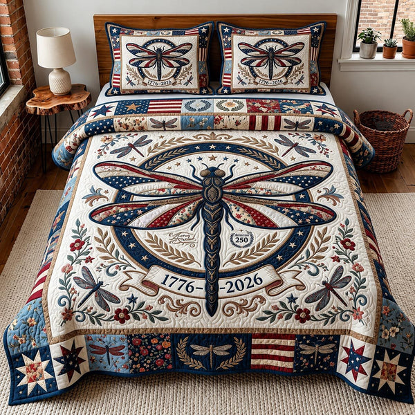 Liberty Dragonfly quilted 3-piece bedding set on a made bed in a warmly lit bedroom