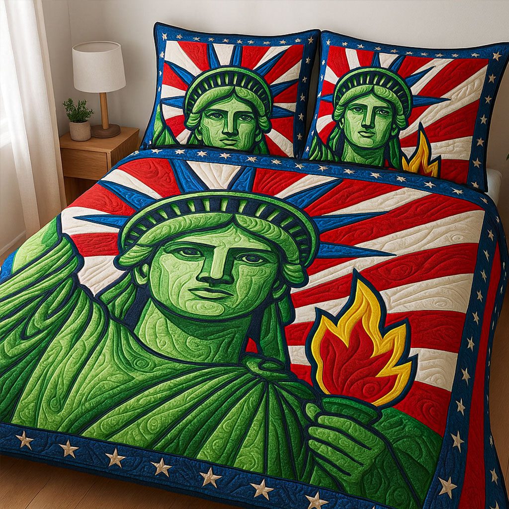 Liberty Flame quilted 3-piece bedding set on a made bed in a warmly lit bedroom