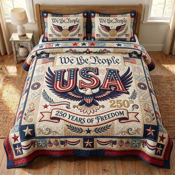 Liberty Freedom quilted 3-piece bedding set on a made bed in a warmly lit bedroom