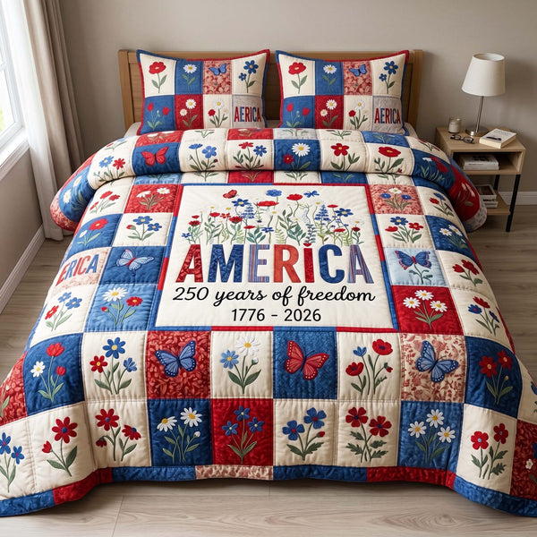 Liberty Garden quilted 3-piece bedding set on a made bed in a warmly lit bedroom