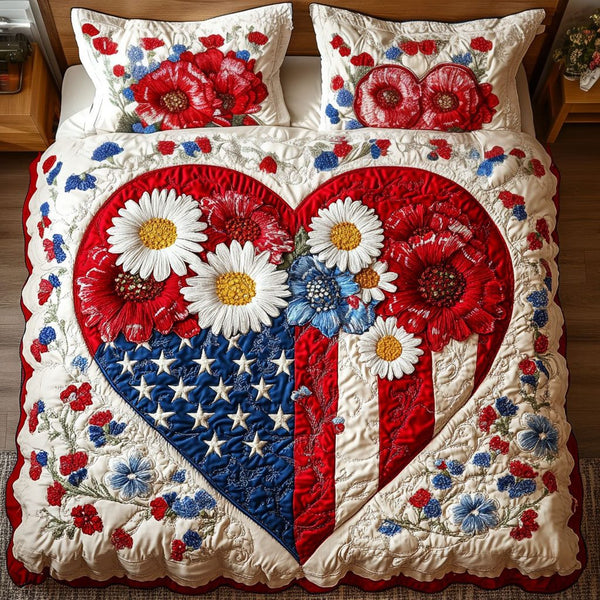 Liberty in Bloom quilted 3-piece bedding set on a made bed in a warmly lit bedroom