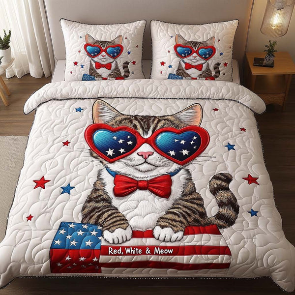 Liberty Kitty quilted 3-piece bedding set on a made bed in a warmly lit bedroom