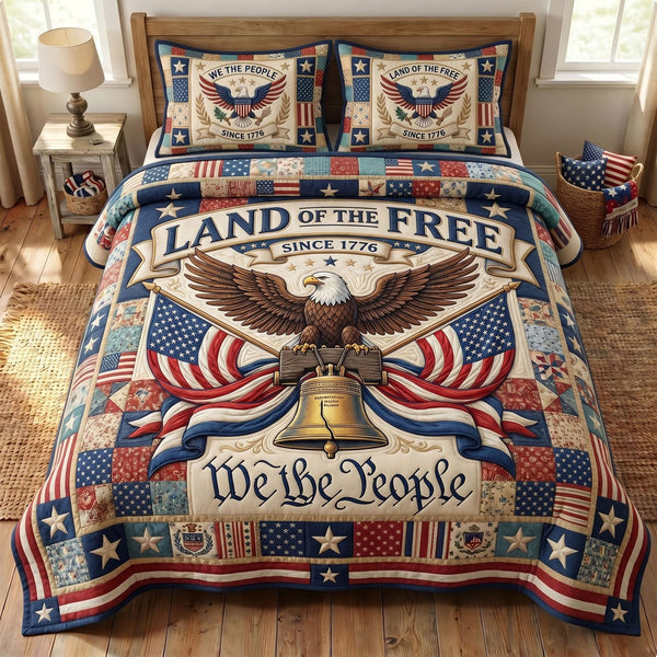 Liberty Legacy quilted 3-piece bedding set on a made bed in a warmly lit bedroom