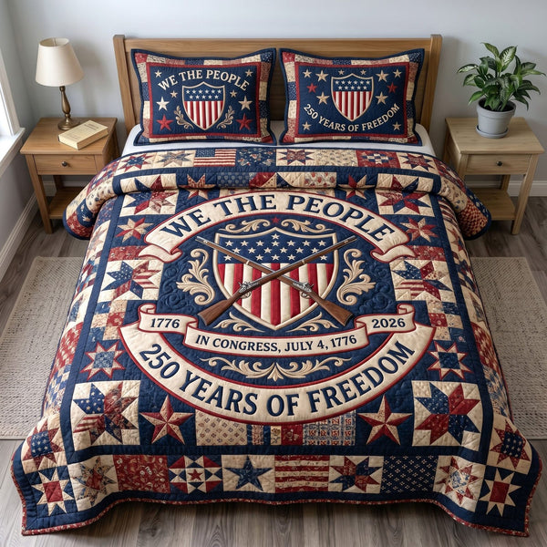 Liberty Legacy quilted 3-piece bedding set on a made bed in a warmly lit bedroom