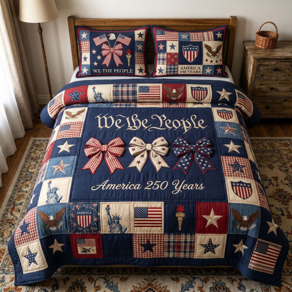 Liberty Legacy quilted 3-piece bedding set on a made bed in a warmly lit bedroom