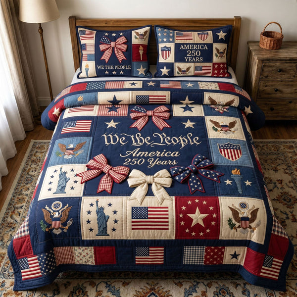 Liberty Legacy quilted 3-piece bedding set on a made bed in a warmly lit bedroom