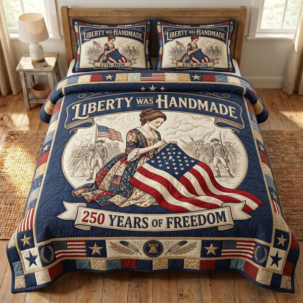 Liberty Legacy quilted 3-piece bedding set on a made bed in a warmly lit bedroom